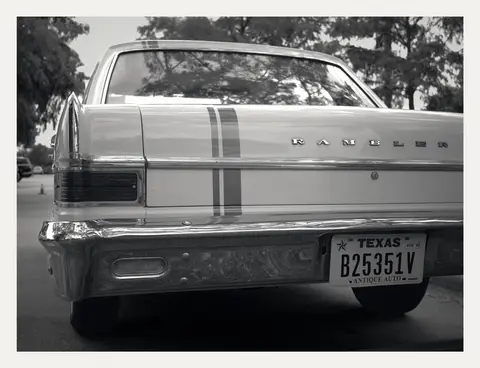 RAMBLER script and twin racing stripes