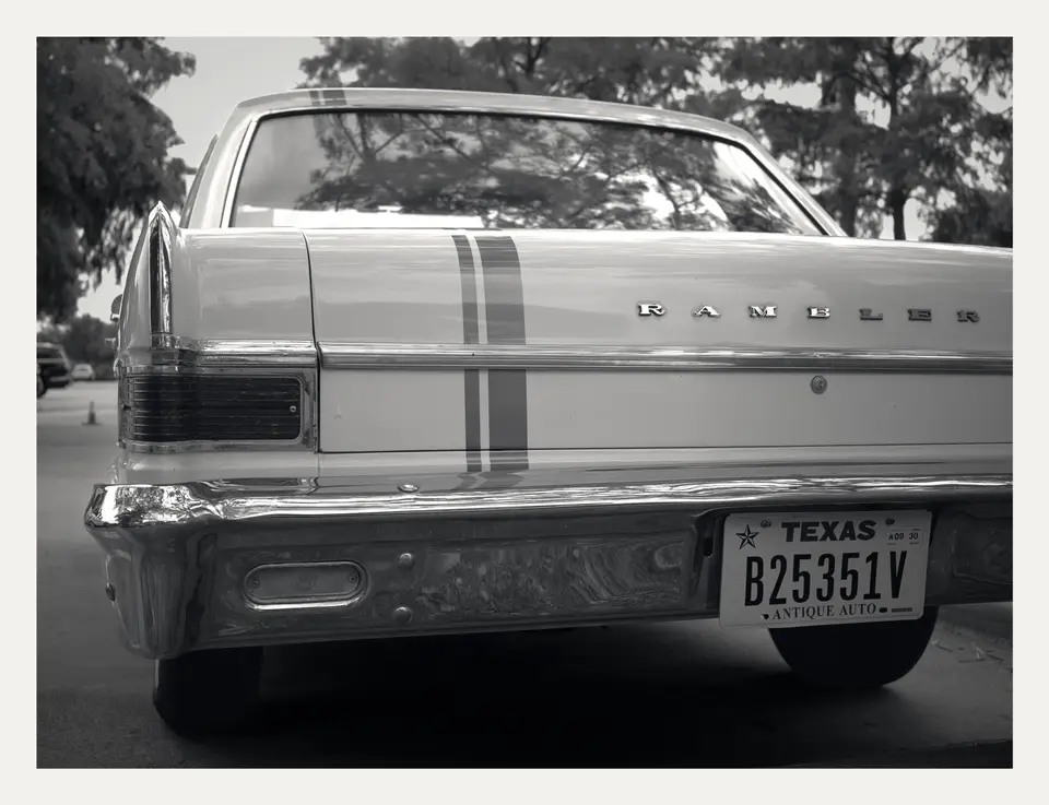 RAMBLER script and twin racing stripes