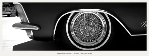 Wire spokes and a fat whitewall