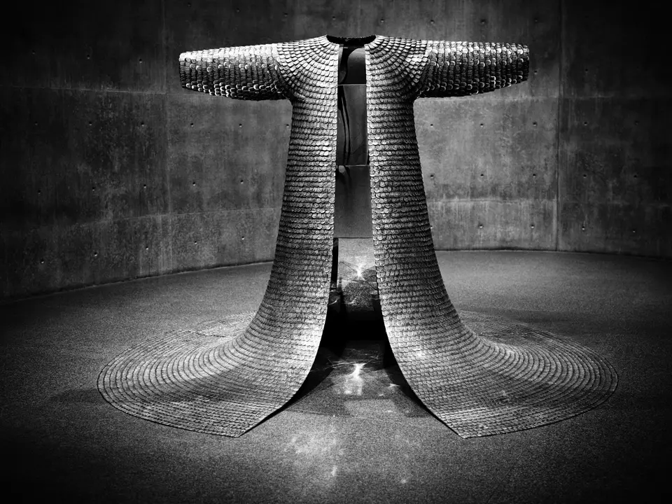 Scale-mail robe in the concrete room